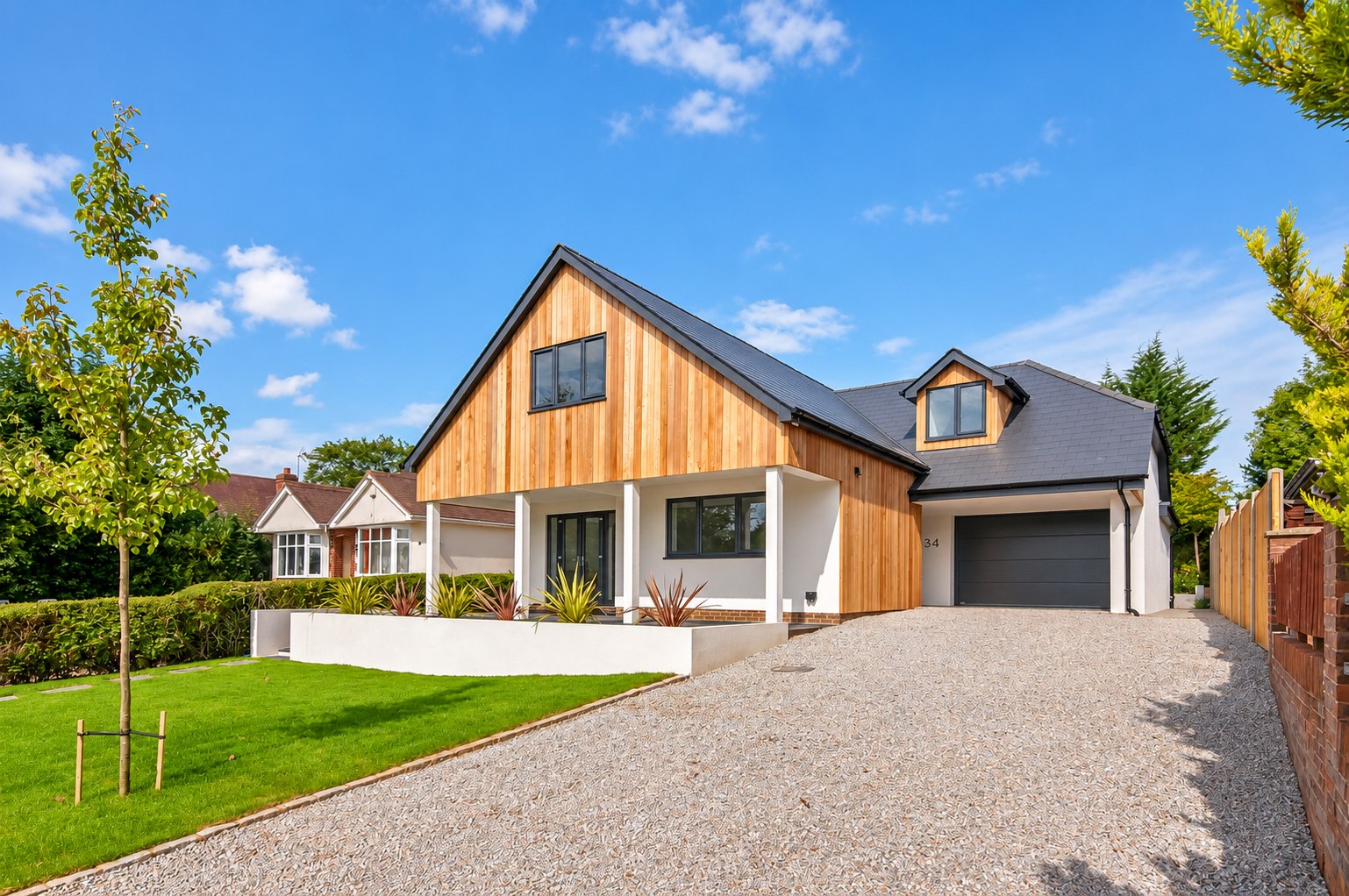 Cedar-clad gable and white rendered home at 34 Stoney Lane